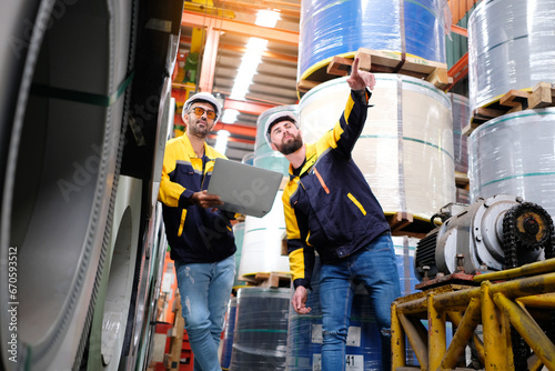 Tableau sur toile Engineer working to inspect production process in factory.