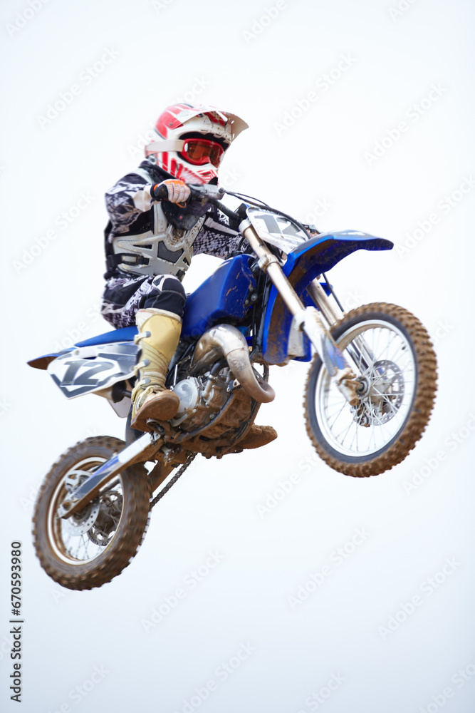 Person, motorcycle and air jump in sky as professional in action, competition or fearless risk. Bike rider, off road transportation stunt or fast speed adventure at rally, extreme sport race or brave Person, motorcycle and air jump in sky as professional in action, competition or fearless risk. Bike rider, off road transportation stunt or fast speed adventure at rally, extreme sport race or brave