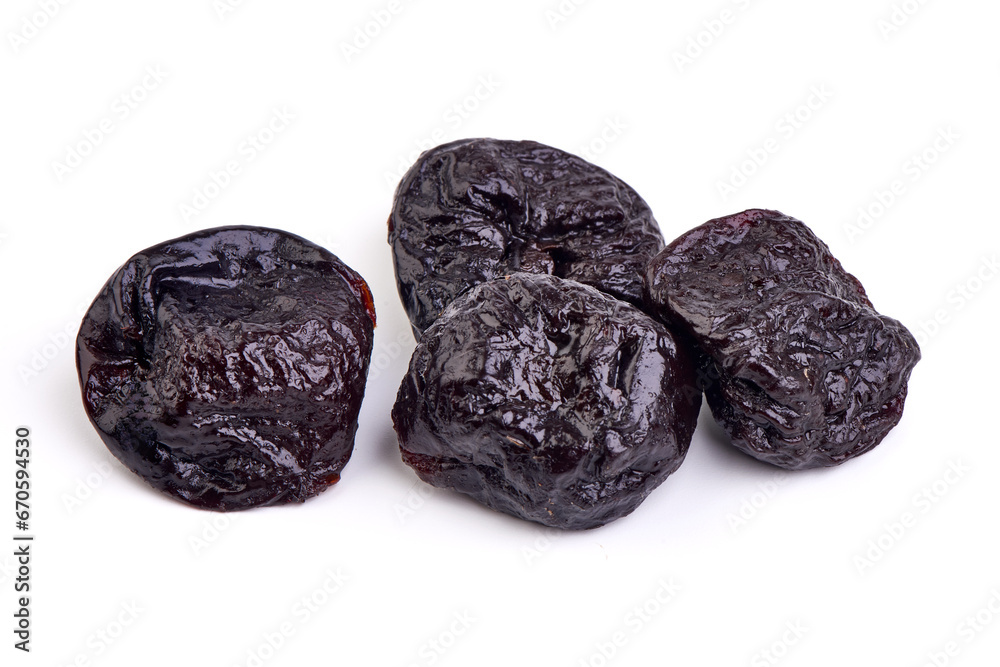 Prunes, dried fruits, close-up, isolated on white background. Prunes, dried fruits, close-up, isolated on white background.