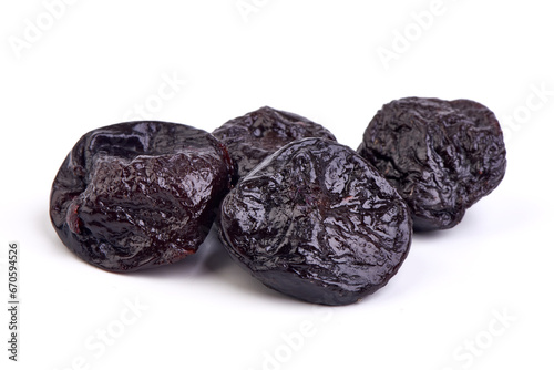 Prunes, dried fruits, close-up, isolated on white background.