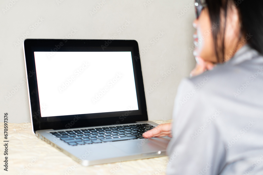Young Woman Using Laptop At Home Young Woman Using Laptop At Home