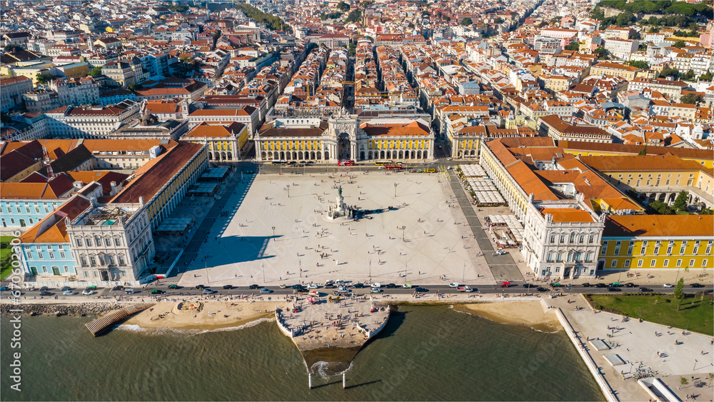 Aerial drone point of view of Commercio Square, Downtown Lisbon, Portugal. Panoramic view of cold city center. Travel destination visited annually by many foreigner tourists. Sunset colours 