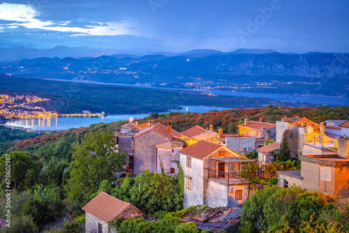 Historic town of Dobrinj and turquoise Soline bay evening view photo