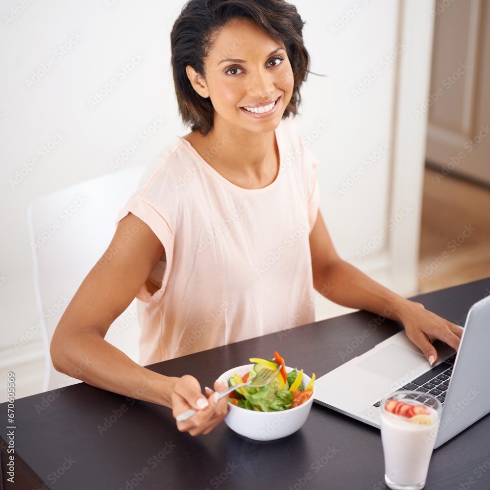Eating, salad and woman with remote work, laptop and healthy food or nutrition in home and office. Happy, portrait and working on lunch break with fruit and vegetables for energy or wellness in house Eating, salad and woman with remote work, laptop and healthy food or nutrition in home and office. Happy, portrait and working on lunch break with fruit and vegetables for energy or wellness in house