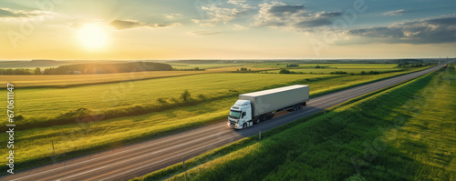 Truck on freeway top air view. Truck driving at beautiful spring landscape.