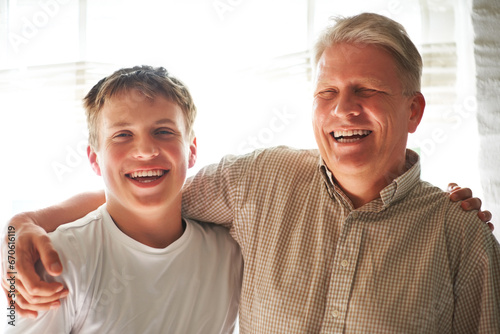 Grandparent, teenager and embrace with smile, happy and hug with love, grandchild and home. Elderly, support or bonding together for relationship, family and retired with boy, house and grandfather