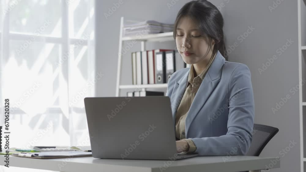 Freelance businessman stretches his body because he feels tired after working on his laptop. Lifestyle woman relaxing after working too hard with project plans at home. Freelance businessman stretches his body because he feels tired after working on his laptop. Lifestyle woman relaxing after working too hard with project plans at home.