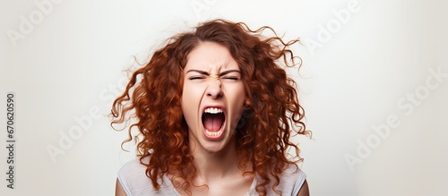 A depiction of a stunning youthful lady fiercely shouting and imitating animal sounds against a backdrop of pure white photo