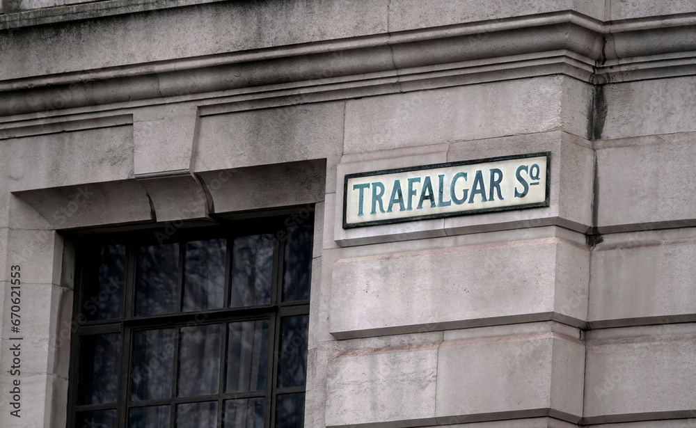 Sign for Trafalgar Square on the wall of a building in London, England. Sign for Trafalgar Square on the wall of a building in London, England.