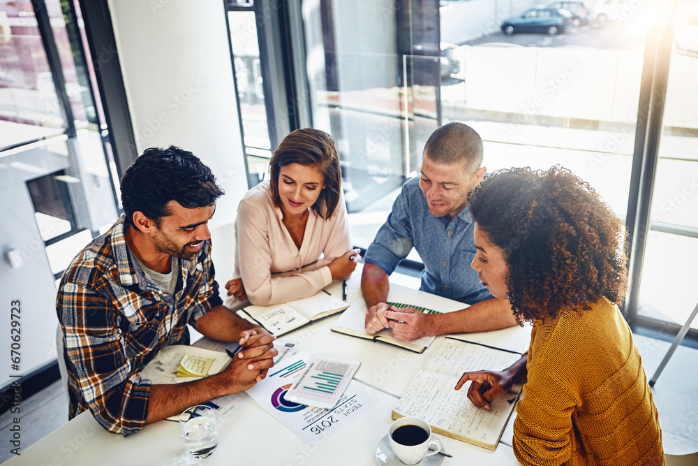 © Grady Reese/peopleimages.com - Office, meeting and paperwork with stats, data and analysis of report with market research for kpi and goals. Analytics, graphs and above people at desk in workplace with online marketing strategy