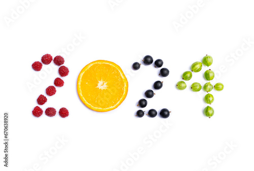 New year 2024 made of fruit and berries on the white background.