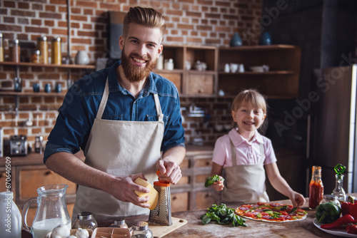 Dad and daughter cooking © georgerudy