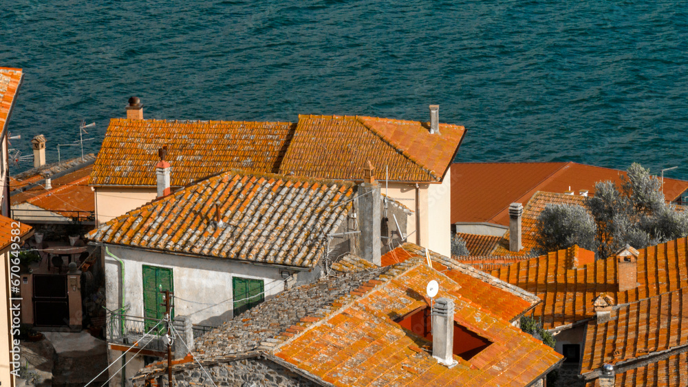 Aerial view of the sloping roofs of the houses in the historic center of Trevignano Romano, in the metropolitan city of Rome, Italy. The town is located on the volcanic Lake Bracciano.