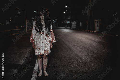 Horror woman concept,Ghost on the road in the city,A vengeful spirit on the street of the town,Halloween festival,Make up ghost face