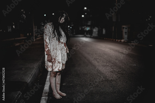 Horror woman concept,Ghost on the road in the city,A vengeful spirit on the street of the town,Halloween festival,Make up ghost face © reewungjunerr