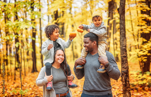 happy family playing on autumn park togerher