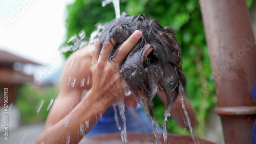 Teen Kid Washing Hair in Public Fountain, Slow-Motion Refreshment on Hot Summer Street in Europe