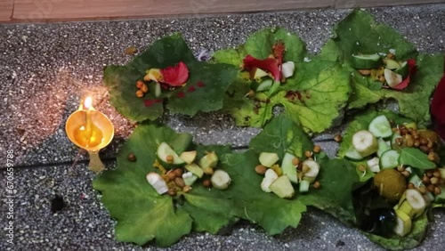 holy offerings on traditional rituals at home for children's wellbeing from different angle photo