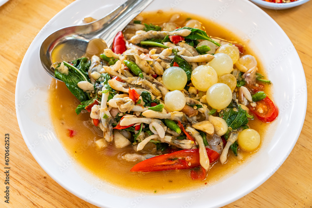 Stir fried spicy catfish roe and Razor clam with Thai herbs