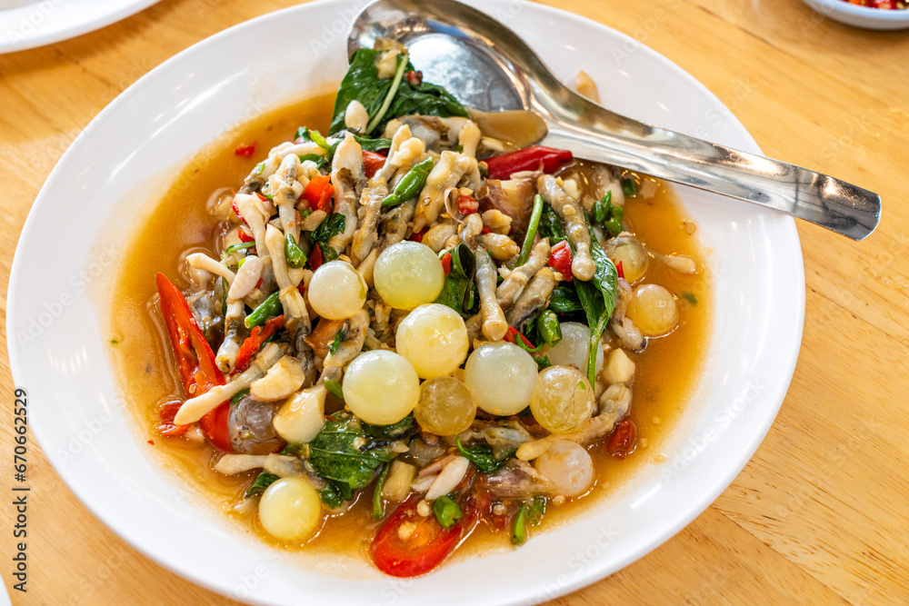 Stir fried spicy catfish roe and Razor clam with Thai herbs