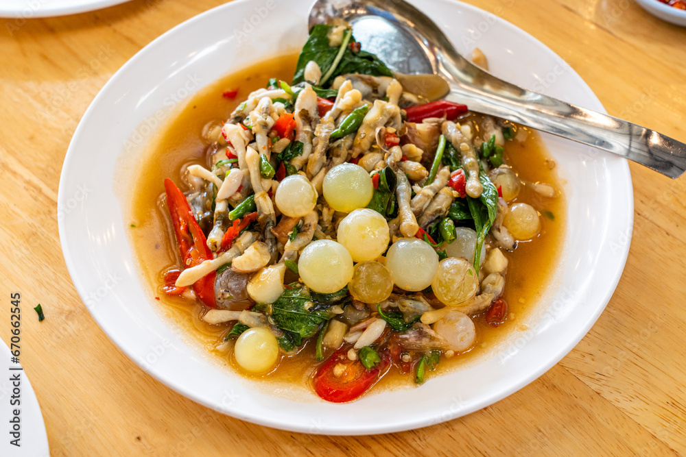 Stir fried spicy catfish roe and Razor clam with Thai herbs
