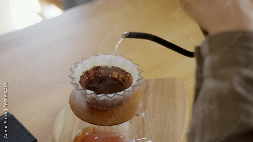 Process of brewing pour over coffee with V60 decanter. Extremely close-up shot of the finished hot beverage dripping into the dispensing container Process of brewing pour over coffee with V60 decanter. Extremely close-up shot of the finished hot beverage dripping into the dispensing container