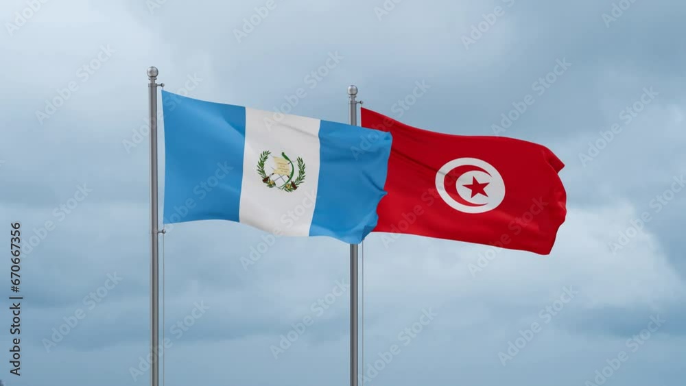 Tunisia and Guatemala flag waving together on cloudy sky, endless seamless loop, two country cooperation concept Tunisia and Guatemala flag waving together on cloudy sky, endless seamless loop, two country cooperation concept