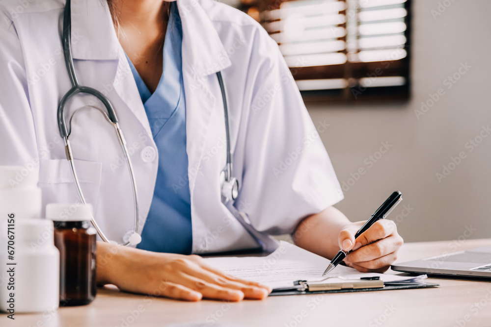 Medical technology concept. Doctor working with mobile phone and stethoscope in modern office Medical technology concept. Doctor working with mobile phone and stethoscope in modern office