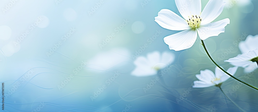 An illustration of a flower with green stems and leaves against a defocused background of abstract light blue and white textures An illustration of a flower with green stems and leaves against a defocused background of abstract light blue and white textures