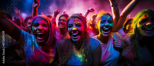 Happy youth dance and have fun at the Holi festival. Nightlife of active youth. Party and entertainment concept. Banner