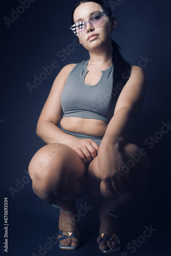Curvy influencer fitness gym girl posing