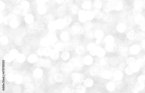 White and gray bokeh background. Photo can be used for the concepts of New Year, Christmas, Wedding Anniversary and all celebrations.  
