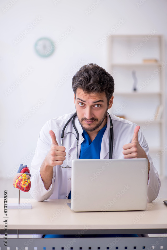 Young male doctor in telemedicine concept Young male doctor in telemedicine concept