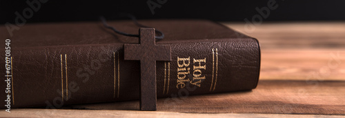 wooden cross with Holy Bible