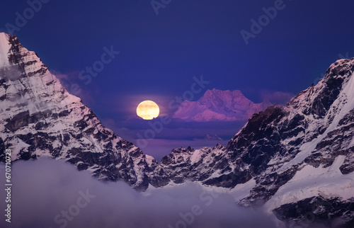 Kangchenjunga mount: Majestic Third-Highest Peak at 8586m, Full Moonrise from Mera Peak High Camp, a breathtaking moment in the Himalayas. Traveling, beauty in Nature and mountaineering concept photo. photo