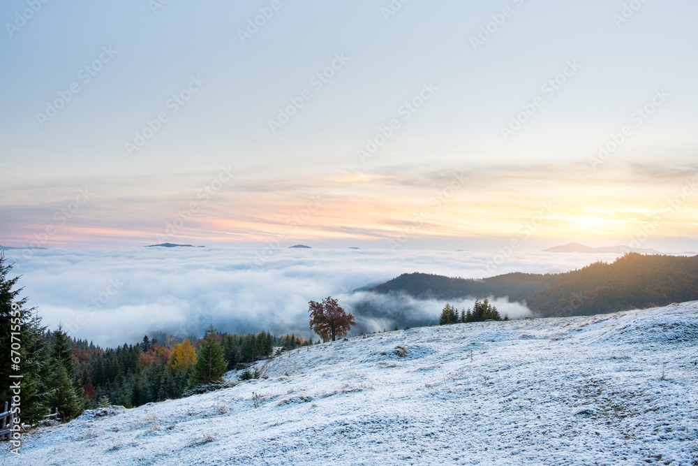 First snow cover field in mountain. Beautiful autumn morning.