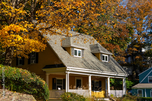 Stunning family home exterior view surrounded by fall colors in Brighton, Massachusetts, USA 