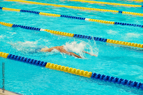 Turquoise swimming pool lanes, a symbol of sport and the Olympics.