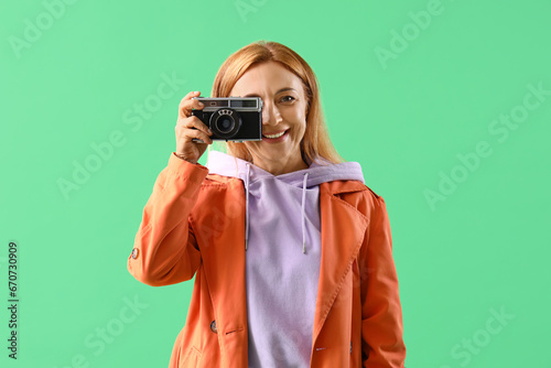 Mature woman in coat with p...