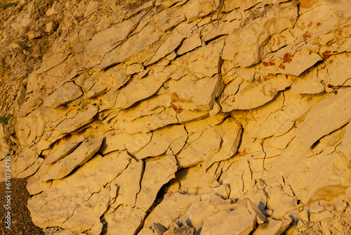 scree from the mountain on the shore stones from opoka at the golden hour, close-up texture