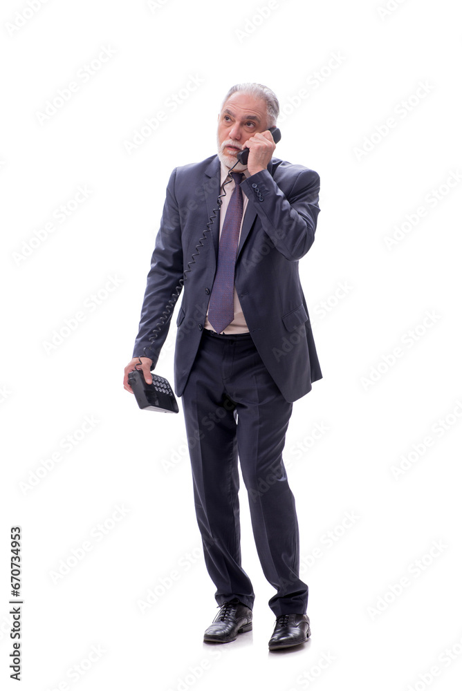 Old businessman talking by phone isolated on white Old businessman talking by phone isolated on white