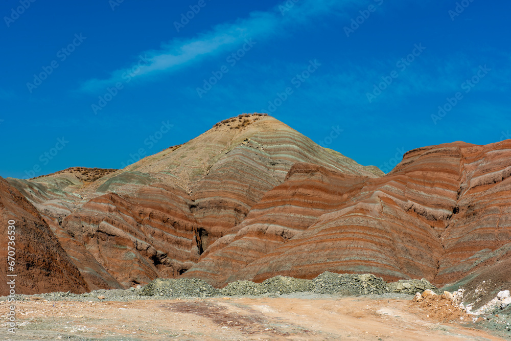 Obraz premium Nallihan District in Ankara, Turkey. The Girl Hill Natural Monument (Rainbow Hills) the geological structure with its colorful rainbow tones. Nallihan Bird Sanctuary.