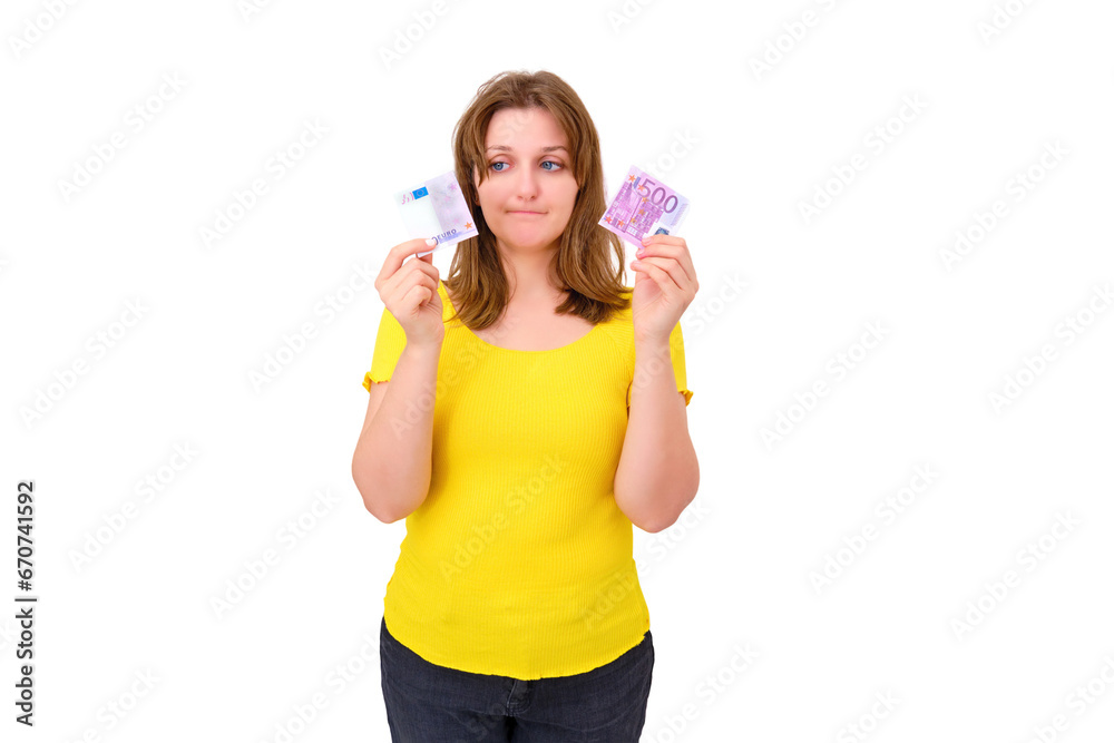 The concept of wasted money on interest on the loan, isolated on a white background. A distraught woman holds a 500 Euro bill torn in half. The concept of wasted money on interest on the loan, isolated on a white background. A distraught woman holds a 500 Euro bill torn in half.