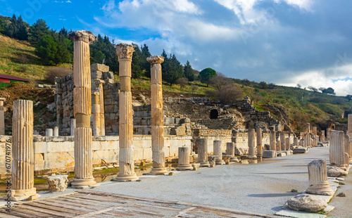 Ruins of the Upper Agora at Ephesus ancient site in Turkey. View of fragments of columns; with the Sacred Street and Odeon