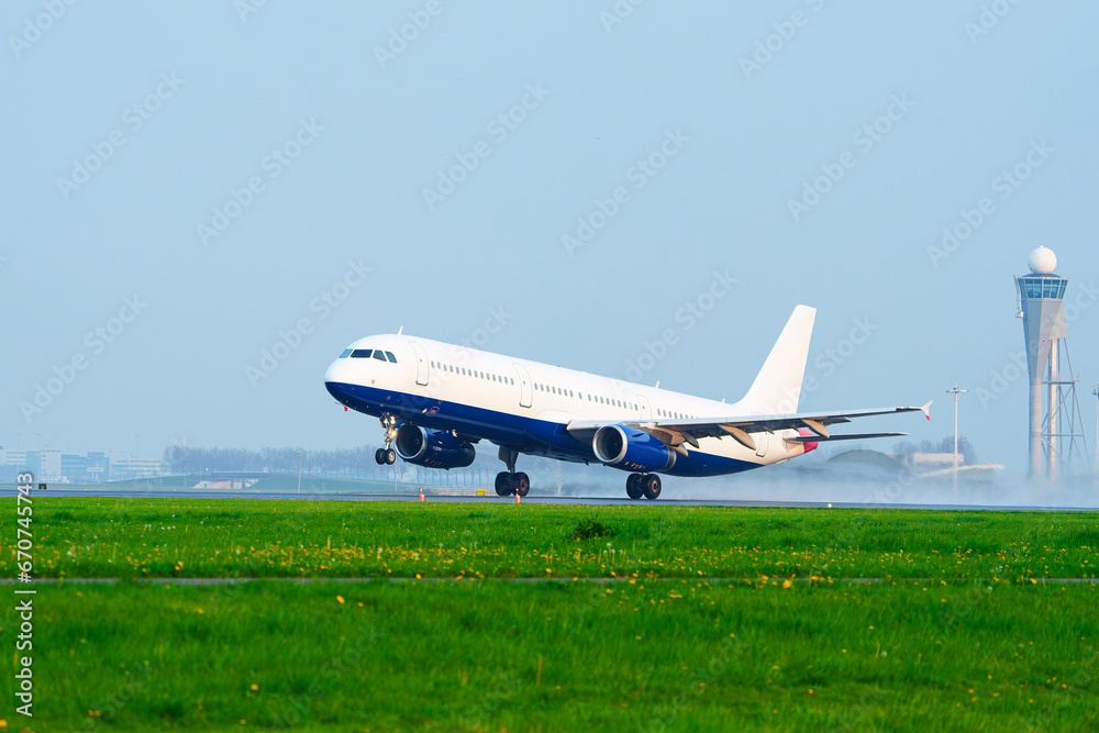 Passenger Plane Taking Off on Runway in Rainy Condition: Travel Destination Weather. Passenger Plane Taking Off on Runway in Rainy Condition: Travel Destination Weather.