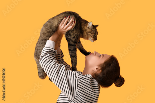 Pretty young woman kissing ...