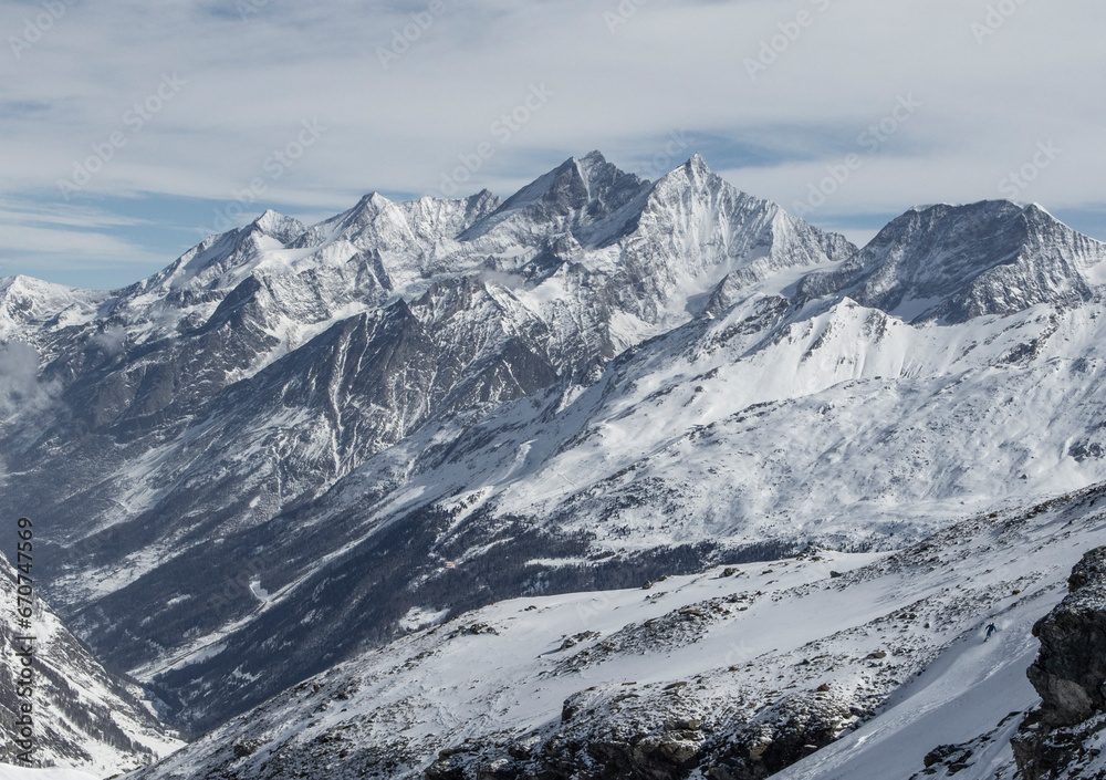Mountain and landscape covered with snow against sky Mountain and landscape covered with snow against sky