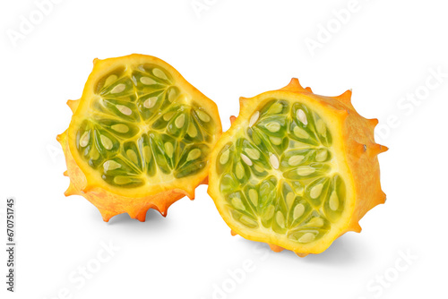 Kiwano fruit, green horned melon isolated on white, transparent background, PNG. Organic orange kiwano, African horned melon slices with green, jelly like inside with seeds close up.