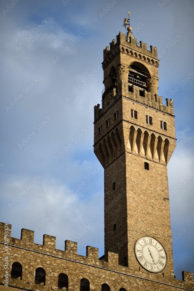 a clock tower sitting on the top of a tall building