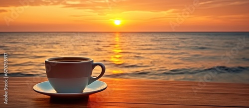 Morning coffee by beach at sunrise. Seaside serenity. Sunset by ocean rustic wooden table. Beachside. Mug against sky and sea